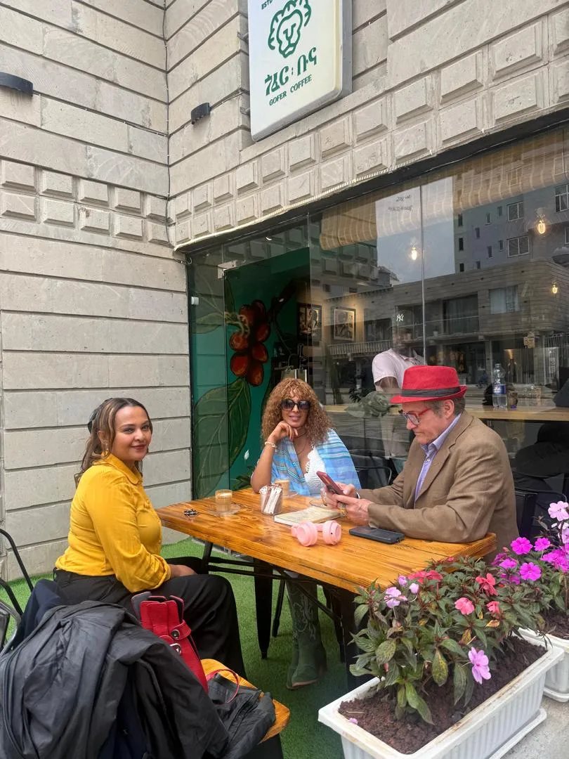 Guests on the terrace outside Gofer Coffee in Bole Medhanialem, Addis Ababa