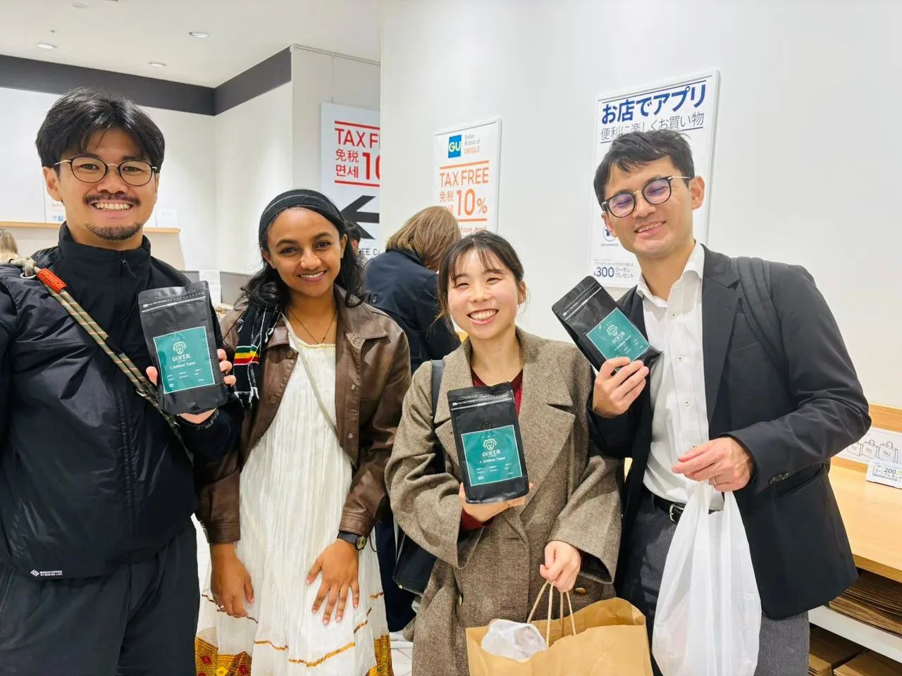 Customers in Japan holding bags of Gofer Coffee